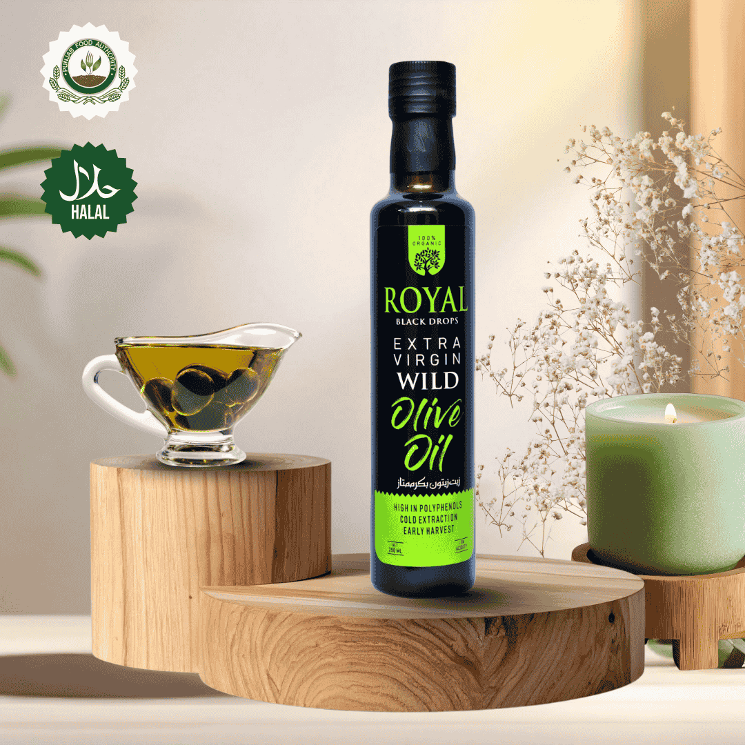 Bottle of Royal Extra Virgin Wild Olive Oil on a wooden stand with a cup of olives and candle in the background.